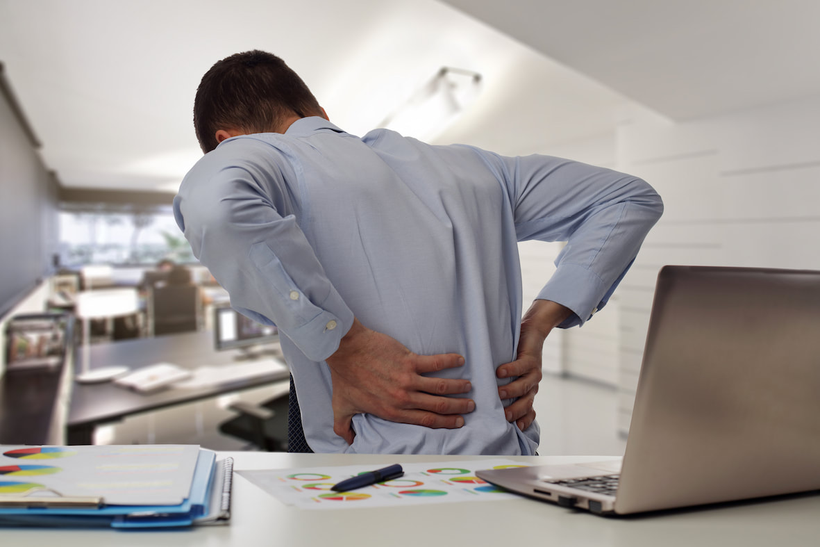 Office worker with back in pain